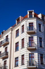 Windows on the facade of the Art Nouveau building in Poznan.