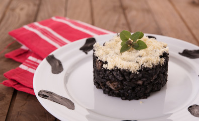 Black risotto with parmesan
