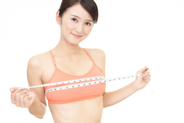 Fototapeta na wymiar 胸囲を測る女性 