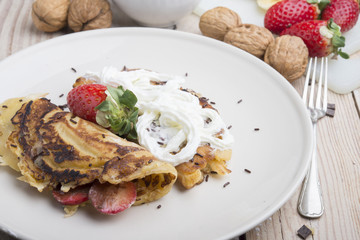 delicious crepes with berries and chocolate sauce, closeup