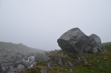Rock, steep slope and cliff in the mist, subarctic mountains, Swedish Lapland