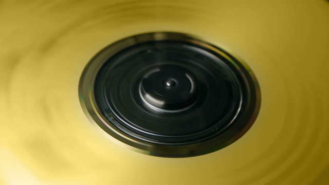 Golden CD spinning fast inside player Loop Video.