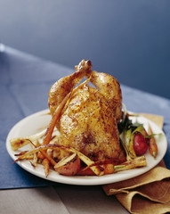 Roasted chicken with carrots, parsnips and potatoes.