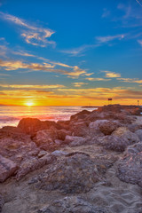 Portrait view of boulders on the Ventura beach jetty.