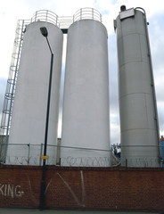 Group of stainless steel tower silos