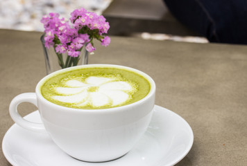 milk green tea on wooden floor
