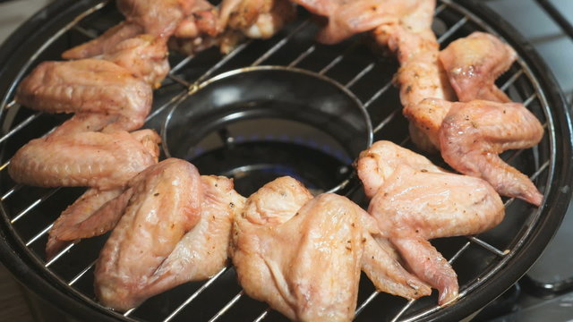 Cooking chicken wings on a gas grill