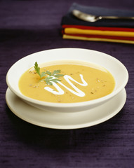 Squash soup with cream garnish