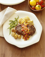 Roasted meat with vegetable served in plate