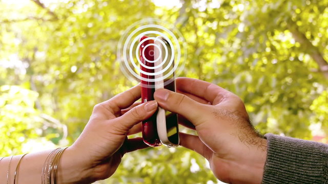 Two Smartphones Sharing NFC Radio Waves. Phones Cloaked in Generic Skins So they don't Show Make or Model.