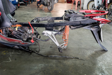 framing of a motorcycle in repair of the damage,Garage shop
