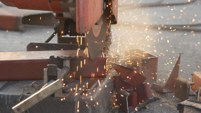 Cutting Steel channel (steel C chanel) with grinder. Sparks while grinding iron