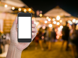 Man hand holding blank screen mobile phone with blur festive gol © littlestocker