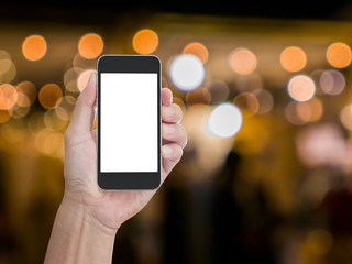 Man hand holding blank screen mobile phone with blur festive gol © littlestocker