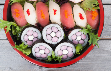 Assorted sushi and maki in a nice tray on wooden table