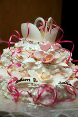 beautiful cake for wedding with figures of swans closeup