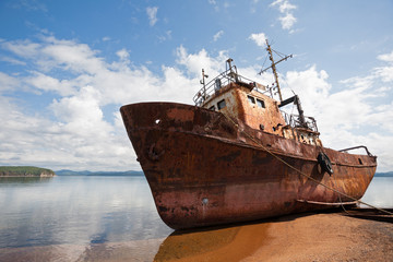 Old fishing vessel on the sea coast