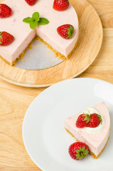 Homemade strawberry cheesecake  on white plate