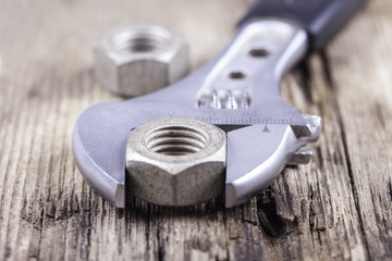wrench background on grungy wood surface