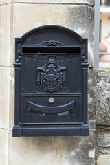 Vintage cast mailbox with emblem. Pano Lefkara, Cyprus.