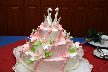 Wedding cake with decorative swans closeup