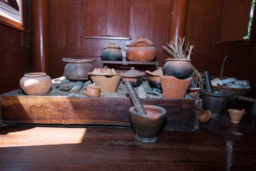 Traditional common thai kitchen with old kitchenware
