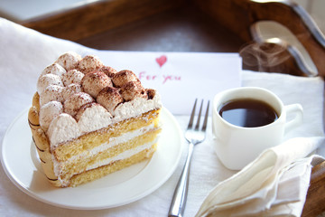 Coffee and tiramisu on the tray 