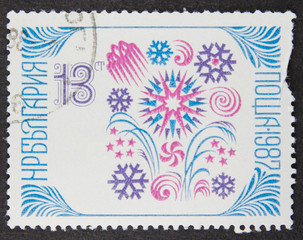 A stamp printed in Bulgaria, shows Sofia stamp exhibition emblem within folklore patterns in new year 1988 series, 1987