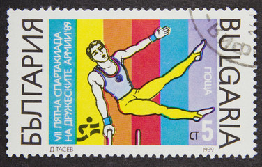A stamp printed in Bulgaria, shows Gymnast in 7th Army Games series, 1989