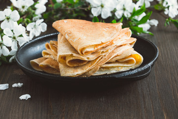 Crepes  folded in triangles on frying pan