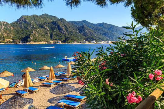 Fototapeta turkey seashore, white sand seacoast, mediterranean sea, a ship in the water, summer vacation