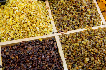Many varieties of raisins on the counter