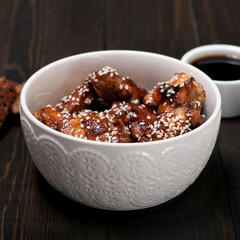 Chicken drumsticks in a sweet and sour sauce in Thai