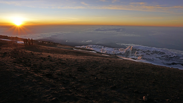 The sun rising from the top of Mount Kilimanjaro. 