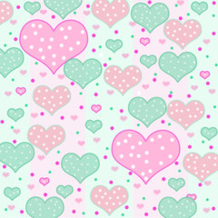 Polka dot hearts of different sizes in shades of pinks and green background.   