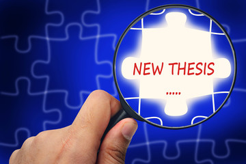 NEW THESIS word. Magnifier and puzzles.