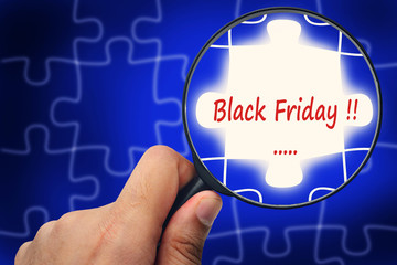 Black Friday word. Magnifier and puzzles.
