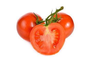 whole and half cut tomato with stem on white background