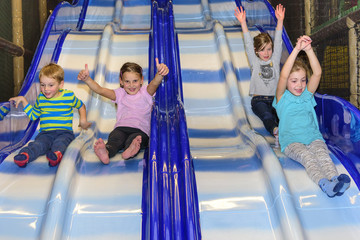 Kids having fun on playground slide