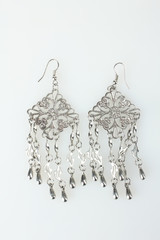 new beautiful women's earrings on a white isolated background