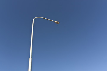 Lamp post and blue sky.