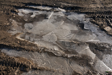 Dirty country road with ice.