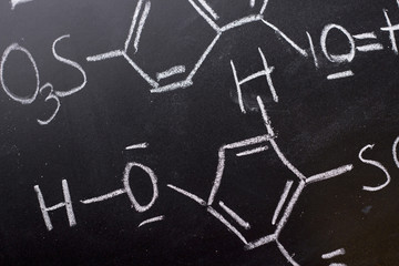 Fototapeta na wymiar Chemical formula on blackboard - handwritten