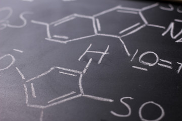Chemical formula on blackboard - handwritten