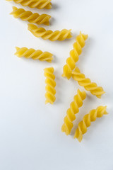 Fusilli pasta isolated on white background. Italian cuisine.