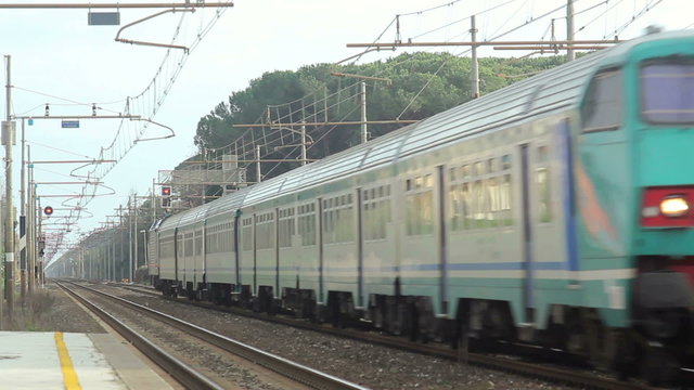 Passenger Green Train is Passing from the Station. High Speed.