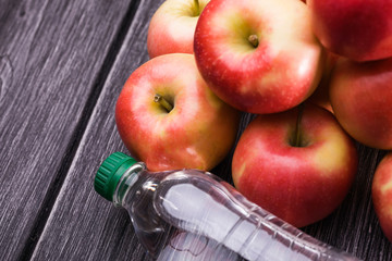 Bottle of soda near apples