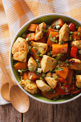 chicken curry with pumpkin and pepper close-up. vertical top view
