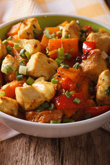 Curry chicken with pumpkin in a bowl close-up. Vertical
