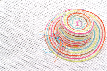 Colorful hat on white daybed, Maldives